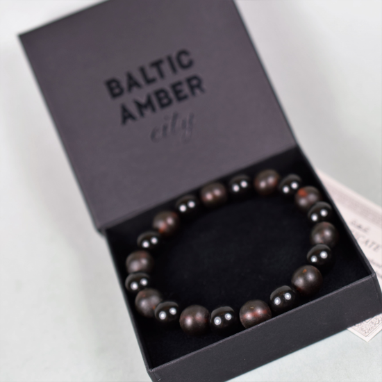 Men's healing bracelet made of black polished amber beads