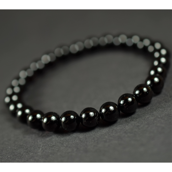 Men's women's healing bracelet made of black polished amber beads