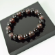 Men's healing bracelet made of black polished amber beads