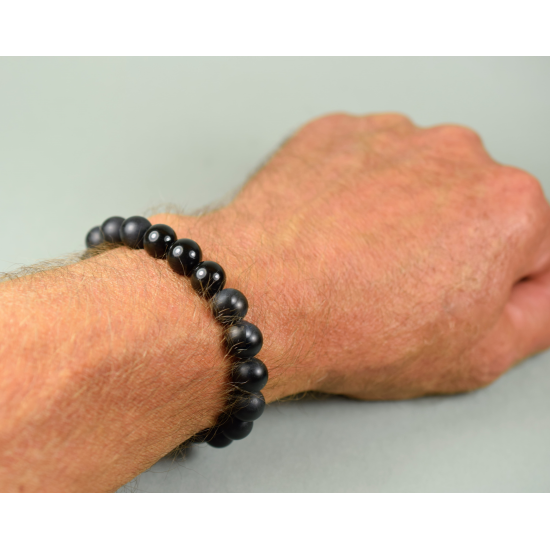 Men's healing bracelet made of black unpolished amber beads
