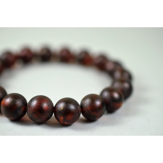 Men's healing bracelet made of dark brown unpolished amber beads