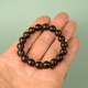 Men's healing bracelet made of dark brown unpolished amber beads