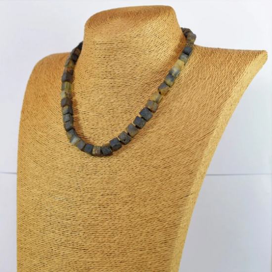 Necklace is made of square pieces of amber