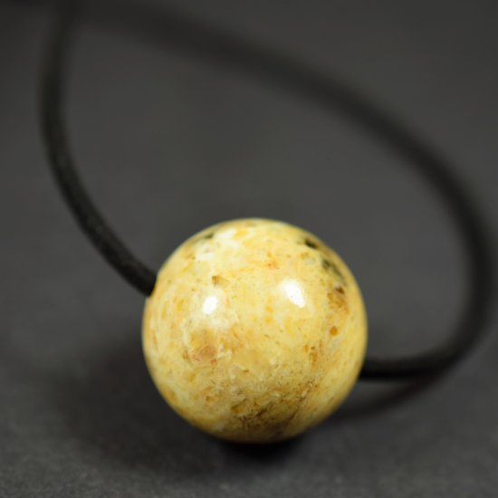 Amber ball pendant with leather strap, amber amulet, amber medallion