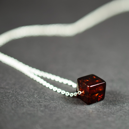 Cognac colored amber cube-pendant with silver chain