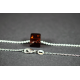 Cognac colored amber cube-pendant with silver chain