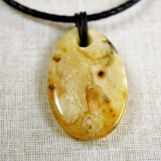 Amber pendant with leather strap