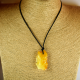 Amber pendant is engraved with leather strap