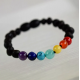 Baby amber bracelet in black raw amber with rainbow colors beads